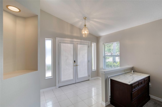 438 Harbour Town Ln, Ormond Beach, FL 32174 - foyer featuring vaulted ceiling, french doors, baseboards, and light tile patterned floors
