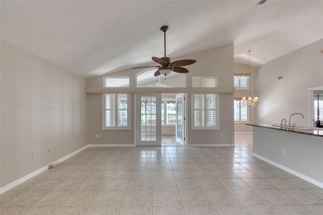 438 Harbour Town Ln, Ormond Beach, FL 32174 - unfurnished living room with a chandelier, lofted ceiling, a ceiling fan, light tile patterned flooring, and a sink