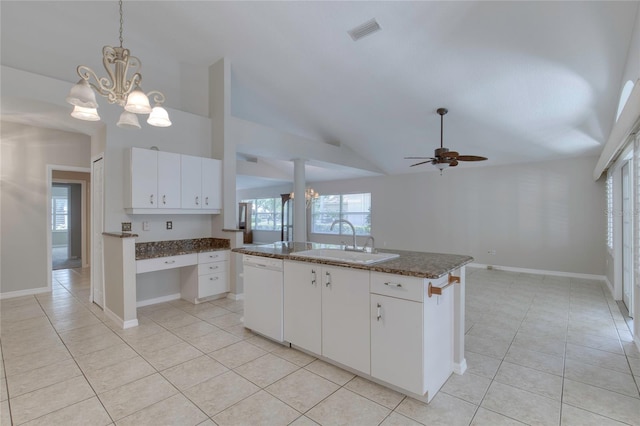 438 Harbour Town Ln, Ormond Beach, FL 32174 - kitchen with dishwasher, a sink, light tile patterned flooring, a chandelier, and lofted ceiling