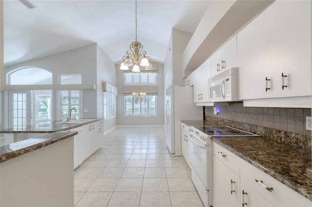 438 Harbour Town Ln, Ormond Beach, FL 32174 - kitchen featuring white appliances, a chandelier, a sink, decorative light fixtures, and tasteful backsplash