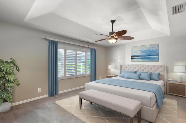 438 Harbour Town Ln, Ormond Beach, FL 32174 - carpeted bedroom with baseboards, a raised ceiling, and ceiling fan