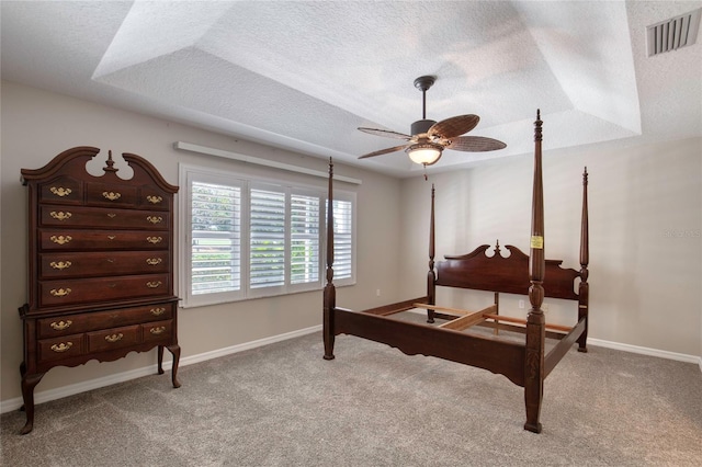 438 Harbour Town Ln, Ormond Beach, FL 32174 - bedroom with a textured ceiling, carpet flooring, baseboards, and ceiling fan