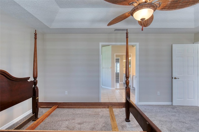 438 Harbour Town Ln, Ormond Beach, FL 32174 - unfurnished bedroom featuring a textured ceiling, carpet flooring, a ceiling fan, and baseboards