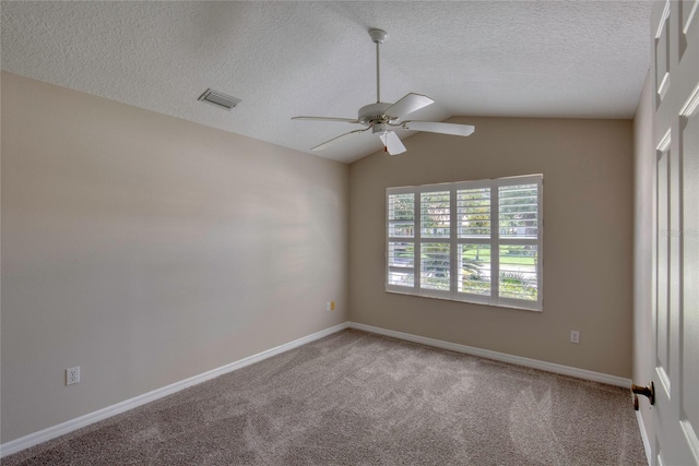 438 Harbour Town Ln, Ormond Beach, FL 32174 - spare room with carpet, a ceiling fan, a textured ceiling, baseboards, and lofted ceiling