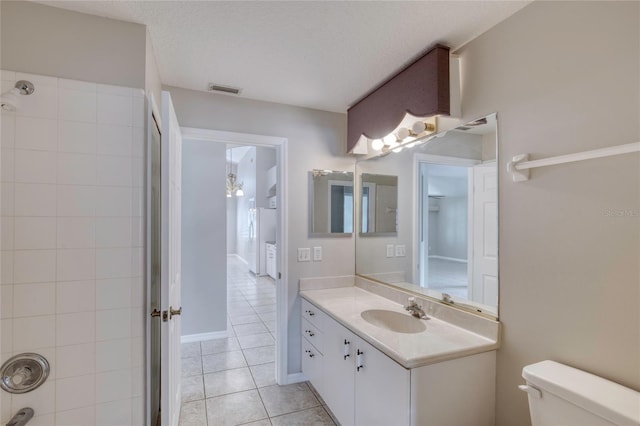 438 Harbour Town Ln, Ormond Beach, FL 32174 - bathroom with tile patterned floors, toilet, vanity, and a shower