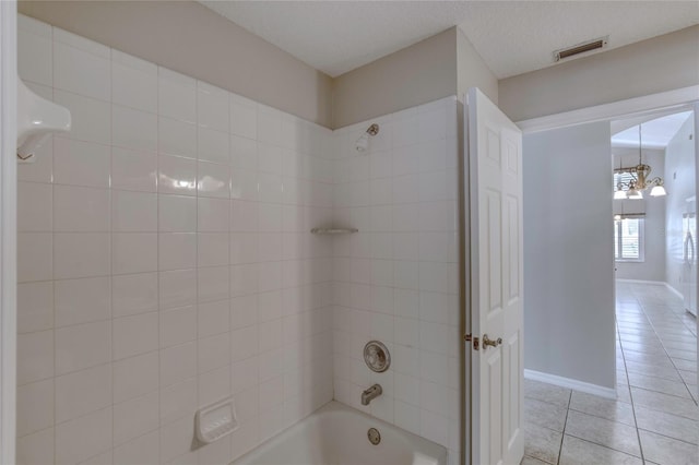 438 Harbour Town Ln, Ormond Beach, FL 32174 - bathroom featuring tile patterned flooring, shower / bath combination, a chandelier, and baseboards