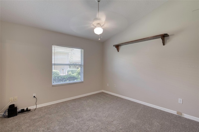 438 Harbour Town Ln, Ormond Beach, FL 32174 - spare room with carpet floors, ceiling fan, baseboards, and vaulted ceiling