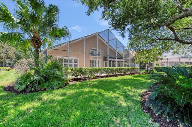 438 Harbour Town Ln, Ormond Beach, FL 32174 - rear view of house featuring stucco siding and a yard