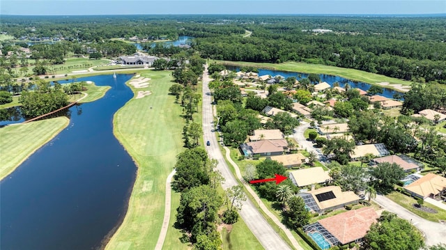 438 Harbour Town Ln, Ormond Beach, FL 32174 - aerial perspective of suburban area featuring a nearby body of water, a heavily wooded area, and a golf course