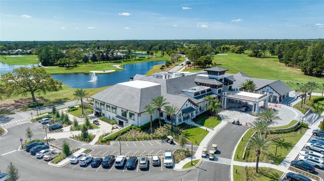 438 Harbour Town Ln, Ormond Beach, FL 32174 - bird's eye view of a large body of water, a golf course, and a tree filled landscape