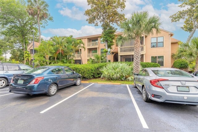 1401 S Palmetto Ave Unit 119, Daytona Beach, FL 32114 - view of property featuring uncovered parking