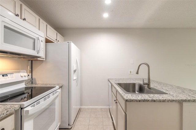 1401 S Palmetto Ave Unit 119, Daytona Beach, FL 32114 - kitchen with white appliances, a sink, baseboards, recessed lighting, and light tile patterned flooring