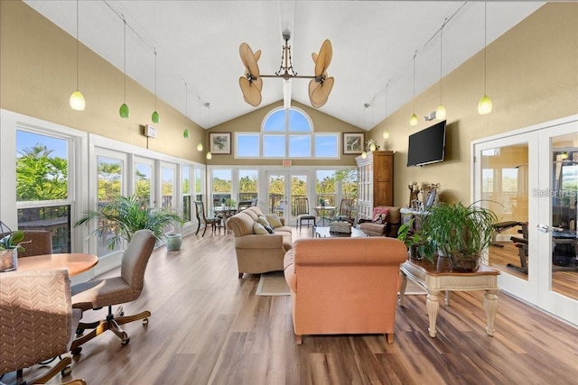 1401 S Palmetto Ave Unit 119, Daytona Beach, FL 32114 - living area featuring french doors, high vaulted ceiling, and wood finished floors