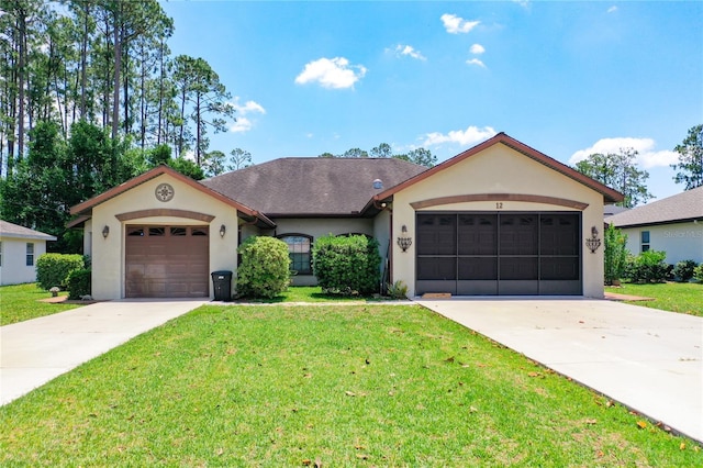 12 Emmons Ln Unit A & B, Palm Coast, FL 32164 - view of front of house with stucco siding, driveway, an attached garage, and a front yard