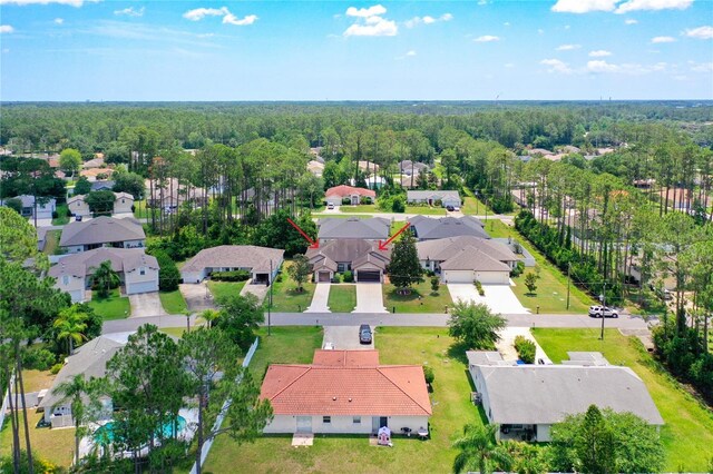 12 Emmons Ln Unit A & B, Palm Coast, FL 32164 - aerial view of property and surrounding area with nearby suburban area and a forest