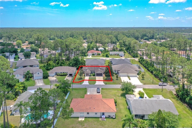 12 Emmons Ln Unit A & B, Palm Coast, FL 32164 - aerial view of residential area with property boundaries highlighted and a heavily wooded area