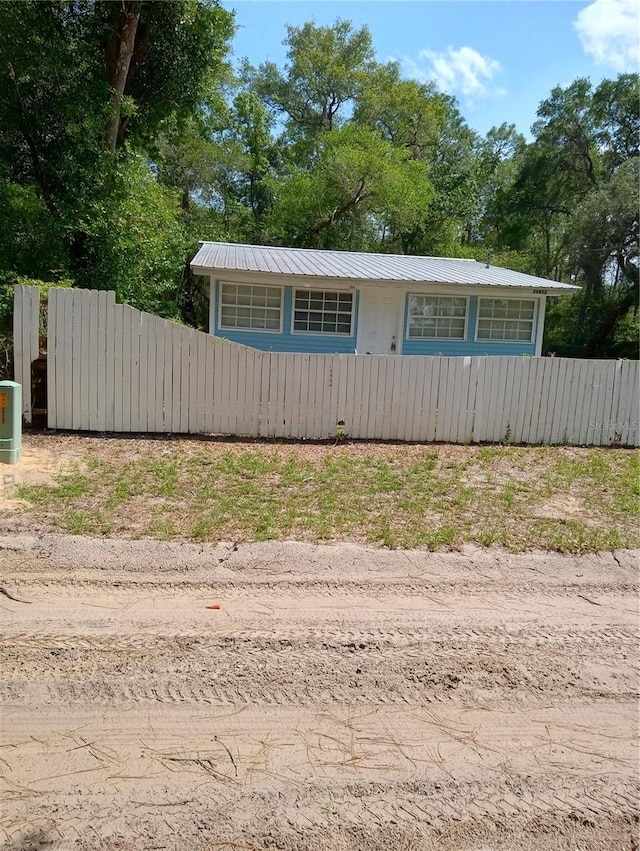 20422 Canvas Back Rd, Altoona, FL 32702 - view of front of house with metal roof and driveway