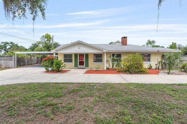 1411 Cliff Ave, Eustis, FL 32726 - single story home with driveway, a carport, and a chimney