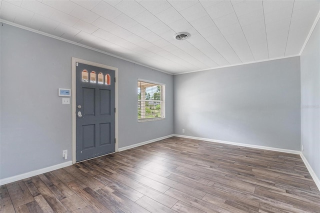 1411 Cliff Ave, Eustis, FL 32726 - entryway featuring ornamental molding, wood finished floors, and baseboards