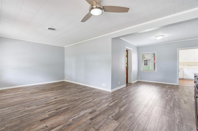 1411 Cliff Ave, Eustis, FL 32726 - spare room featuring ornamental molding, wood finished floors, a ceiling fan, and baseboards