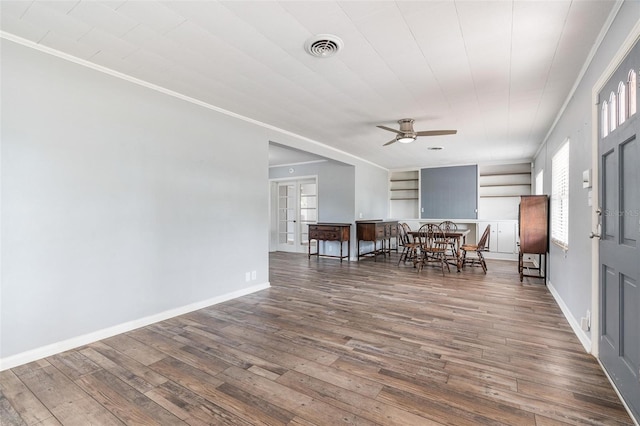 1411 Cliff Ave, Eustis, FL 32726 - dining area featuring ornamental molding, ceiling fan, french doors, wood-type flooring, and baseboards