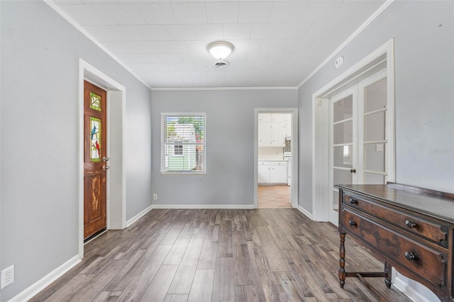 1411 Cliff Ave, Eustis, FL 32726 - entryway with ornamental molding, wood finished floors, and baseboards