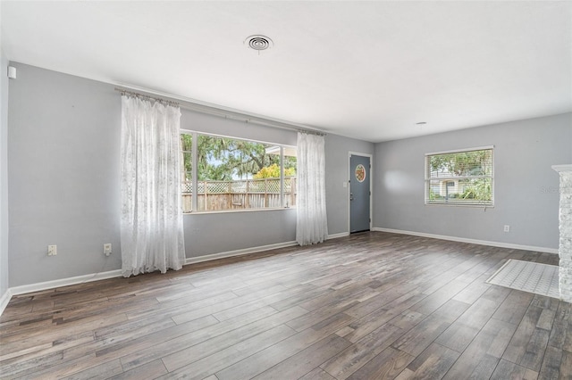 1411 Cliff Ave, Eustis, FL 32726 - spare room with wood finished floors and baseboards
