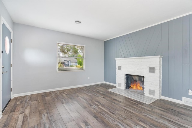 1411 Cliff Ave, Eustis, FL 32726 - unfurnished living room with wood finished floors, a fireplace, and baseboards
