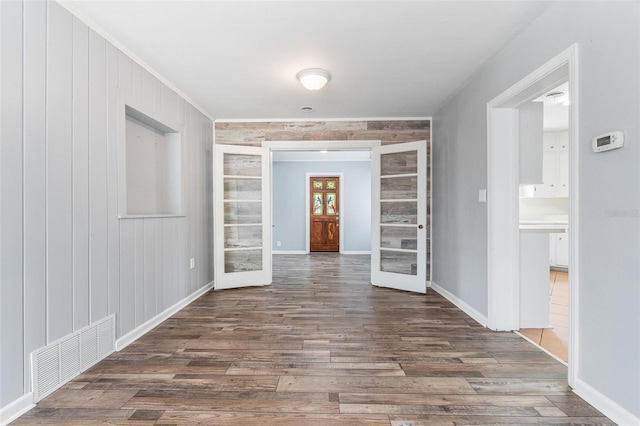 1411 Cliff Ave, Eustis, FL 32726 - unfurnished dining area with wood finished floors, french doors, baseboards, and ornamental molding