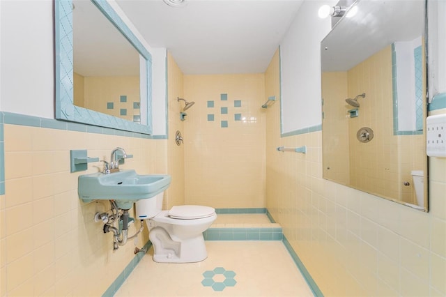 1411 Cliff Ave, Eustis, FL 32726 - full bath featuring tile walls, a tile shower, toilet, and tile patterned floors