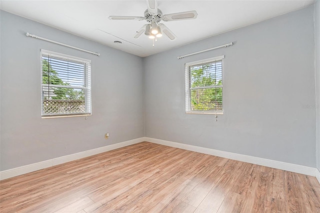 1411 Cliff Ave, Eustis, FL 32726 - unfurnished room with baseboards, light wood-type flooring, and a ceiling fan