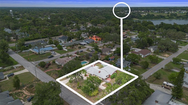 1411 Cliff Ave, Eustis, FL 32726 - aerial view of residential area with property boundaries highlighted, a large body of water, and a forest