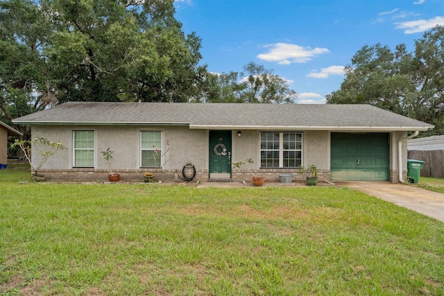 137 Fort Smith Blvd, Deltona, FL 32738 - ranch-style house featuring an attached garage, a front lawn, concrete driveway, stucco siding, and roof with shingles