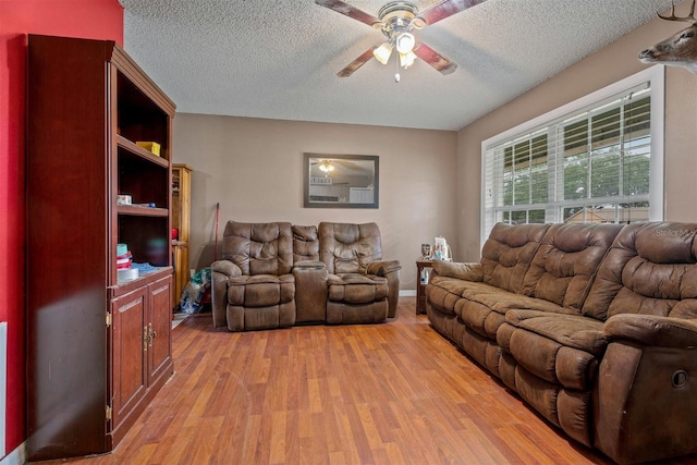 137 Fort Smith Blvd, Deltona, FL 32738 - living room with ceiling fan, light wood-type flooring, and a textured ceiling