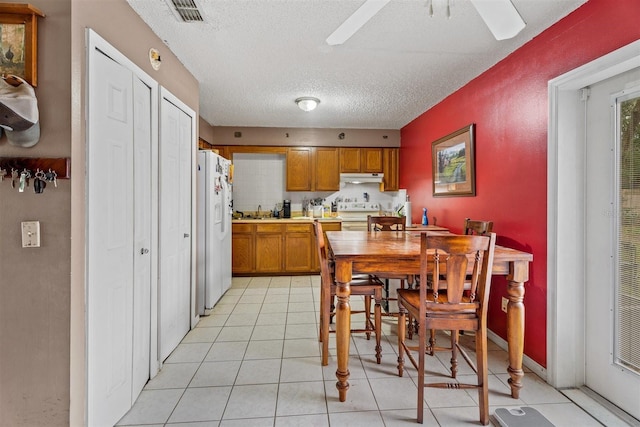 137 Fort Smith Blvd, Deltona, FL 32738 - dining area with a ceiling fan, light tile patterned floors, and a textured ceiling