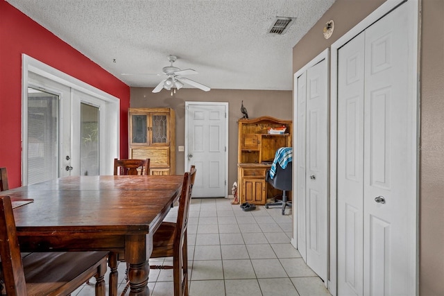 137 Fort Smith Blvd, Deltona, FL 32738 - dining room featuring french doors, a ceiling fan, light tile patterned flooring, and a textured ceiling