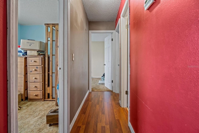 137 Fort Smith Blvd, Deltona, FL 32738 - corridor with wood finished floors, a textured ceiling, and baseboards
