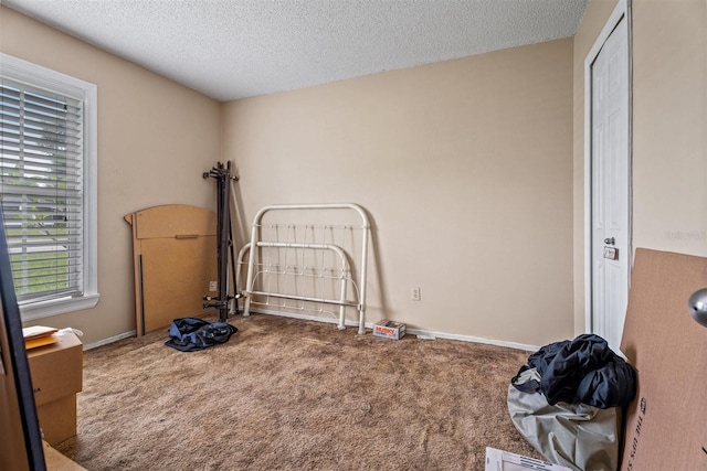 137 Fort Smith Blvd, Deltona, FL 32738 - unfurnished bedroom with carpet, a textured ceiling, and baseboards