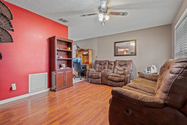 137 Fort Smith Blvd, Deltona, FL 32738 - living room with ceiling fan, light wood-style floors, and a textured ceiling