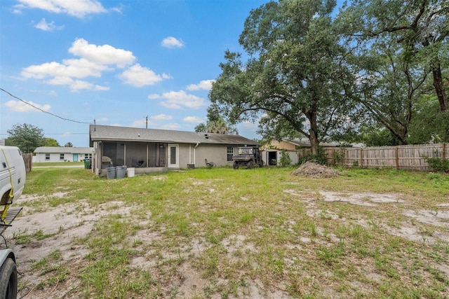 137 Fort Smith Blvd, Deltona, FL 32738 - rear view of property featuring a sunroom and stucco siding