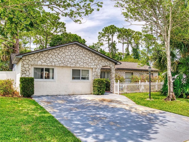 1229 Jeffery Dr, Port Orange, FL 32129 - view of front of home featuring stone siding and stucco siding