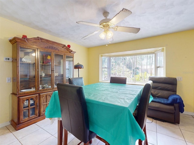 1229 Jeffery Dr, Port Orange, FL 32129 - dining area featuring light tile patterned flooring, baseboards, and a ceiling fan