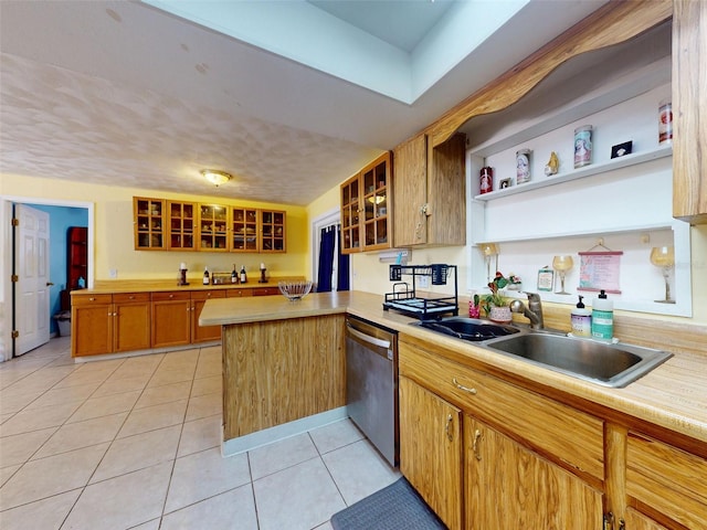 1229 Jeffery Dr, Port Orange, FL 32129 - kitchen featuring stainless steel dishwasher, a sink, open shelves, a peninsula, and light countertops
