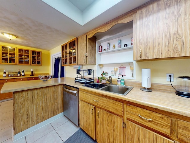 1229 Jeffery Dr, Port Orange, FL 32129 - kitchen featuring stainless steel dishwasher, a sink, light countertops, and a peninsula