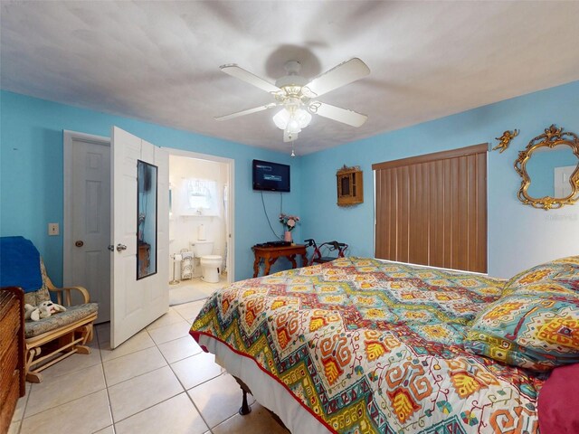 1229 Jeffery Dr, Port Orange, FL 32129 - bedroom featuring light tile patterned floors, ceiling fan, and ensuite bath