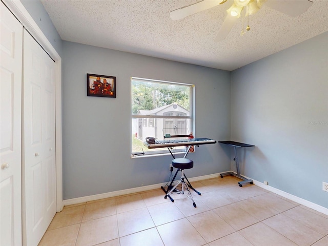 1229 Jeffery Dr, Port Orange, FL 32129 - home office featuring ceiling fan, a textured ceiling, and tile patterned flooring