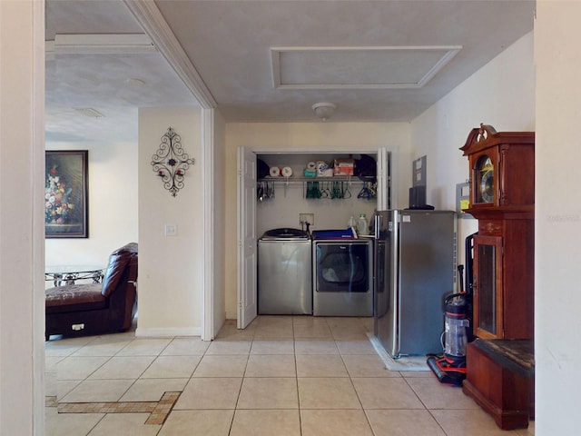 1229 Jeffery Dr, Port Orange, FL 32129 - laundry room featuring washer and clothes dryer, tile patterned floors, and baseboards