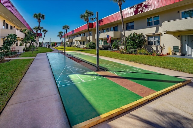 2711 N Halifax Ave Unit 264, Daytona Beach, FL 32118 - view of home's community featuring a lawn, a residential view, and shuffleboard