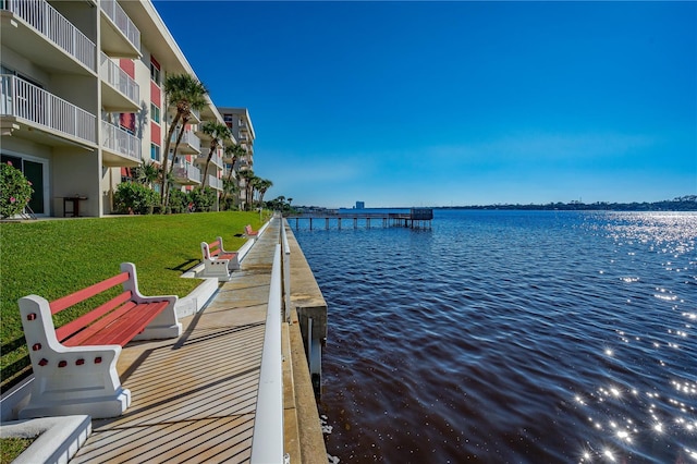 2711 N Halifax Ave Unit 264, Daytona Beach, FL 32118 - dock with a water view and a lawn