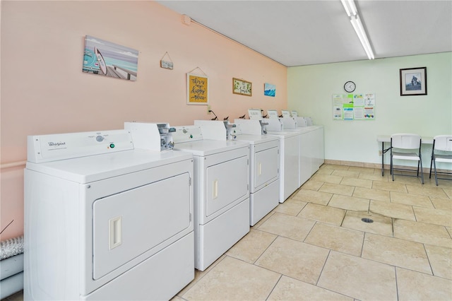 2711 N Halifax Ave Unit 264, Daytona Beach, FL 32118 - communal laundry room featuring washer and dryer and light tile patterned floors